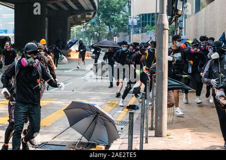 HongKong - November 18, 2019: Protesters running, fleeing from police ...