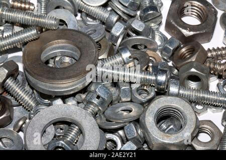Collection of Old Bolt, Screws, Nuts Engineering Metal Tools on White Background Stock Photo