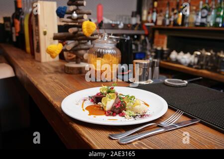 Venison fillet and potato puree served on bar counter, toned photo Stock Photo