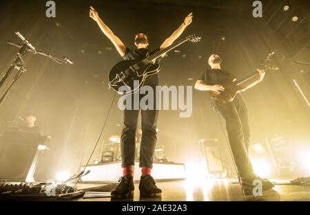 Copenhagen, Denmark. 01st, December 2019. The English indie rock and post-punk band White Lies performs a live concert at VEGA in Copenhagen. Here singer and guitarist Harry McVeigh is seen live on stage with bass player Charles Cave. (Photo credit: Gonzales Photo - Joe Miller). Stock Photo