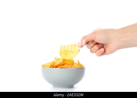 Hand holds potato chips isolated on white background, space for text Stock Photo