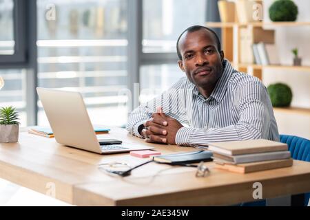 Serious manager looking straight at camera Stock Photo