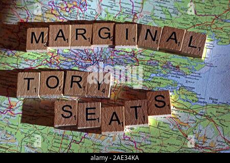 Marginal Tory Seats spelt in Scrabble letters on a UK map - General Election, elections, party political,leaders,parties,claims,doubts Stock Photo