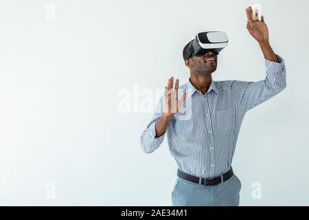 Smiling afro american businessman testing VR device Stock Photo