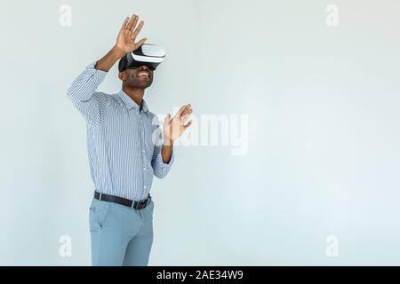 African American young man wearing VR goggles Stock Photo