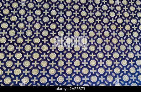 Ceramic mosaic pattern.Colorful floral background. Ceramic mosaic close up. Andalusian ceramic wall. Dirty floral wall fragment photo. Contrast. Tile Stock Photo