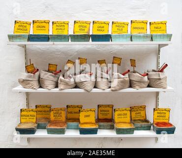 Seville, pain - 28 nov,2019:View of baskets full of various spices.Variety of spices and herbs on the colorful street market stall. Seville Spice shop Stock Photo