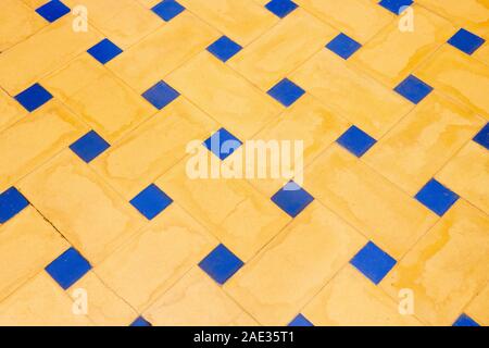 Ceramic mosaic pattern.Colorful blue and yellow background. Ceramic mosaic close up. Ceramic mosaic close up. Andalusian ceramic wall. Stock Photo