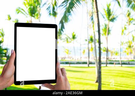 Tablet computer mockup in woman hand. New modern black tablet laptop mockup with blank white screen. Empty space for text. Copy space. Isolated white Stock Photo