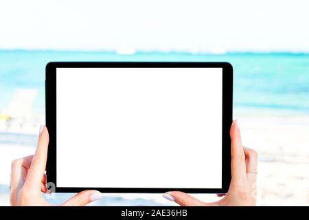 Tablet computer mockup in woman hand. New modern black tablet laptop mockup with blank white screen. Empty space for text. Copy space. Isolated white Stock Photo