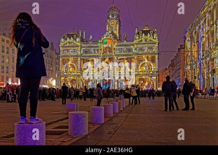 LYON, FRANCE, December 5, 2019 : Festival of lights on City Hall and Place des Terreaux. For 4 nights, artists light up buildings, streets mixing sple