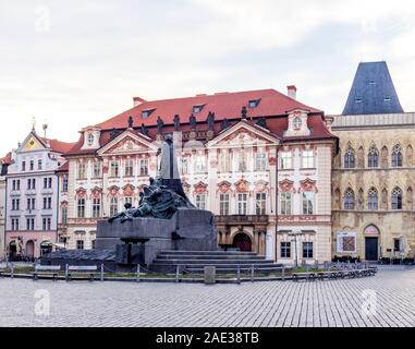 Kinský Palace, House At the Stone Bell and Jan Hus monument in Old Town Square Staré Město Prague Czech Republic. Stock Photo