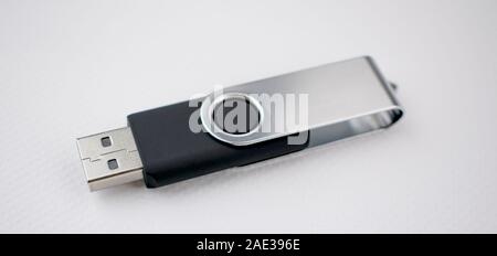 memory unit with usb connection for data storage, metal and satin plastic, black, on white background Stock Photo