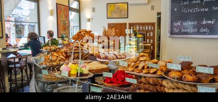 Pastries muffins and cakes on display in a restaurant serving breakfast in Old Town Prague Czech Republic. Stock Photo