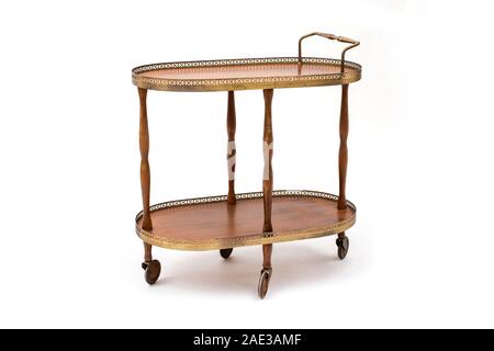 Antique serving trolley on wheels, decorated with galleries Stock Photo