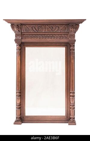 Antique mirror with carved wood frame on the white background. Stock Photo