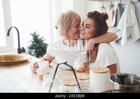 She always will be child for her. Mother and daughter having good time in the kitchen Stock Photo