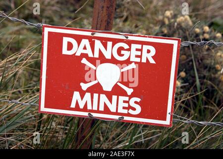 Minefield Sign near Stanley, the capital of the Falkland Islands (Islas Malvinas).  Large areas of land remain unsafe following the Falkland War, a 10 Stock Photo