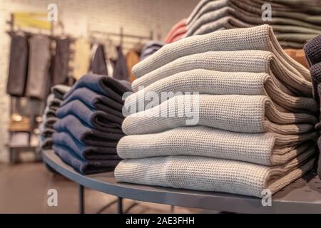 Premium Photo  Stack of wool cloth on shelf