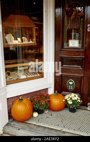 Woodstock, Vermont - September 30th, 2019:  Small shops decorated with Fall pumpkins in the historic New England town of Woodstock. Stock Photo