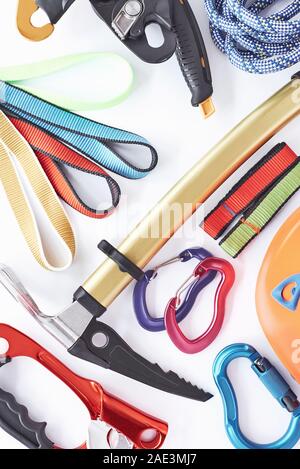 For the tourism activities. Top view. Climbing equipment for the safeness lying on the white table. Conception of extreme sports Stock Photo