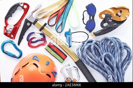 Here's your pack. Top view. Climbing equipment for the safeness lying on the white table. Conception of extreme sports Stock Photo
