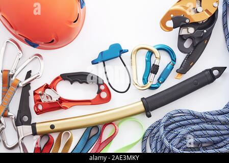 It's ready for use. Top view. Climbing equipment for the safeness lying on the white table. Conception of extreme sports Stock Photo