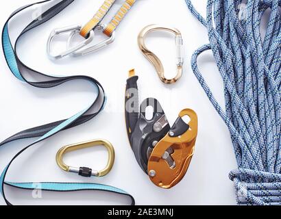 Store shelf. Top view. Climbing equipment for the safeness lying on the white table. Conception of extreme sports Stock Photo