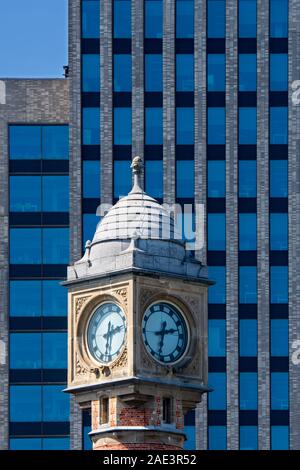 Gent-Sint-Pieters railway station clock tower and Virginie Loveling building / VAC, governmental office in the city Ghent, East Flanders, Belgium Stock Photo