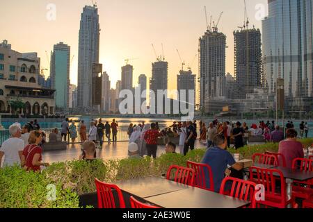 Dubai / UAE - November 5, 2019: View of Souk al Bahar with fountains lake and construction cranes on background . Beautiful Dubai downtown district wi Stock Photo