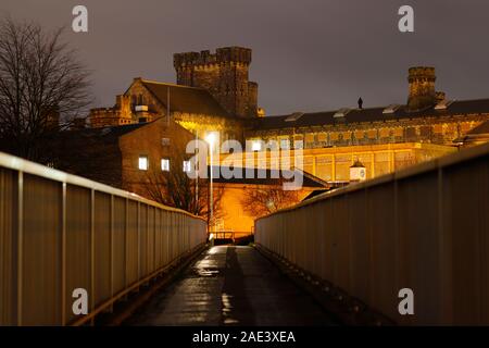 Looking across a pedestrian footbridge, that leads to HM Armley Prison in Leeds. Stock Photo