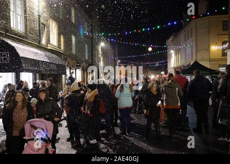 Tavistock, UK. 6 December 2019. Crowds gather to celebrate the annual “Tavistock Dickensian Evening”. The evening is a magical late night shopping event that transports you back in time as shop keepers embrace the spirit and dress up in traditional attire, whilst the smell of chestnuts cooking on steam engines fill the streets. Credit: Julian Kemp/Alamy Live News. Stock Photo