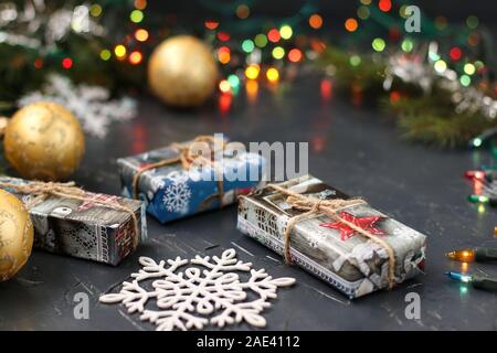 New Year background with a Christmas tree, gifts, balls and snowflake, Twinkle glitter bokeh light Stock Photo