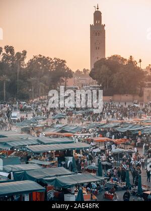 Djemaa el Fna main market place in Marrakech, Morocco while sunset Stock Photo