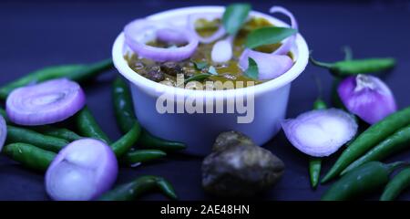 Chickpeas Masala - Chole masala curry on South India. onion, green chilli and fresh curry leave Stock Photo