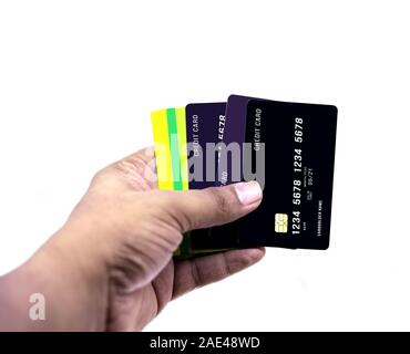 Hand holding credit cards or debit cards isolated on white backgrounds Stock Photo