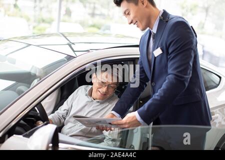 Happy mature couple taking a test drive Stock Photo