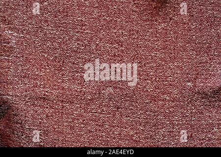 The fabric texture is dark red. Crumpled fabric. Copy space. Stock Photo