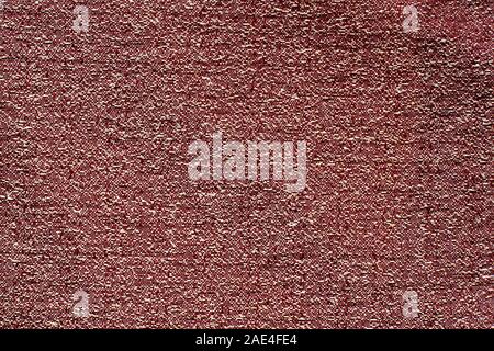 The texture of the fabric. Dark red with white spots, crumpled dense fabric. Copy space. Stock Photo