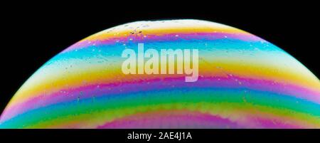 Curve of colorful soap bubble macro close up view Stock Photo