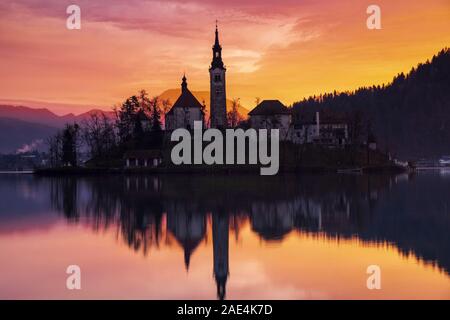 Sunset in the Bled lake. Beautiful reflections. Slovenia. Stock Photo