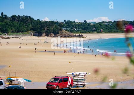 People enjoying the beach on a summers day at St.Brelades Bay,Jersey,Channel Islands Stock Photo