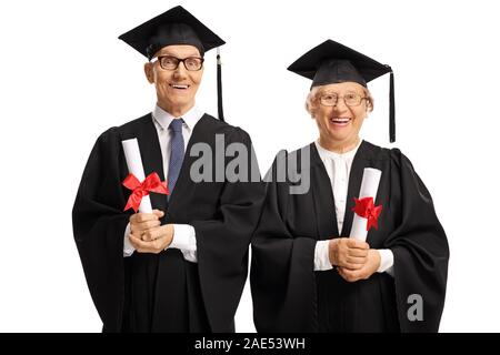 Elderly people in graduation gowns holding diplomas isolated on white background Stock Photo