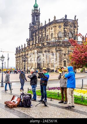 Musicians busking in Theaterplatz and Cathedral of the Holy Trinity  Dresden Saxony Germany. Stock Photo