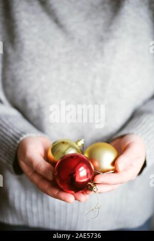 Woman holding red christmas ball Stock Photo