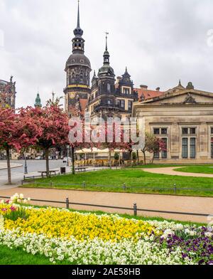 Garden in Theatreplatz Schinkelwache, and clock tower of Royal Palace Dresden Castle Altstadt Dresden Saxony Germany. Stock Photo