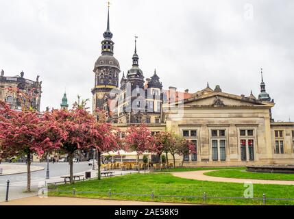 Garden in Theatreplatz Schinkelwache, and clock tower of Royal Palace Dresden Castle Altstadt Dresden Saxony Germany. Stock Photo