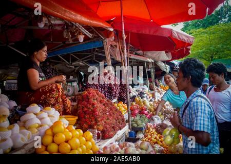 Vendors sell colourful fresh produce in a street market in Yangon (formerly Rangoon) in Myanmar (Burma)