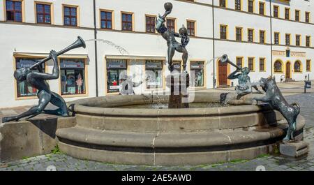 Narren und Musikanten or Fools and Musicians Bronze sculptures and fountain by Erika Harborth sculptor Marktplatz Altstadt Torgau Saxony Germany. Stock Photo