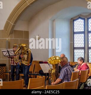 Brass band playing in Castle Hartenfels chapel the first Protestant church in the world, Altstadt Torgau Saxony Germany. Stock Photo